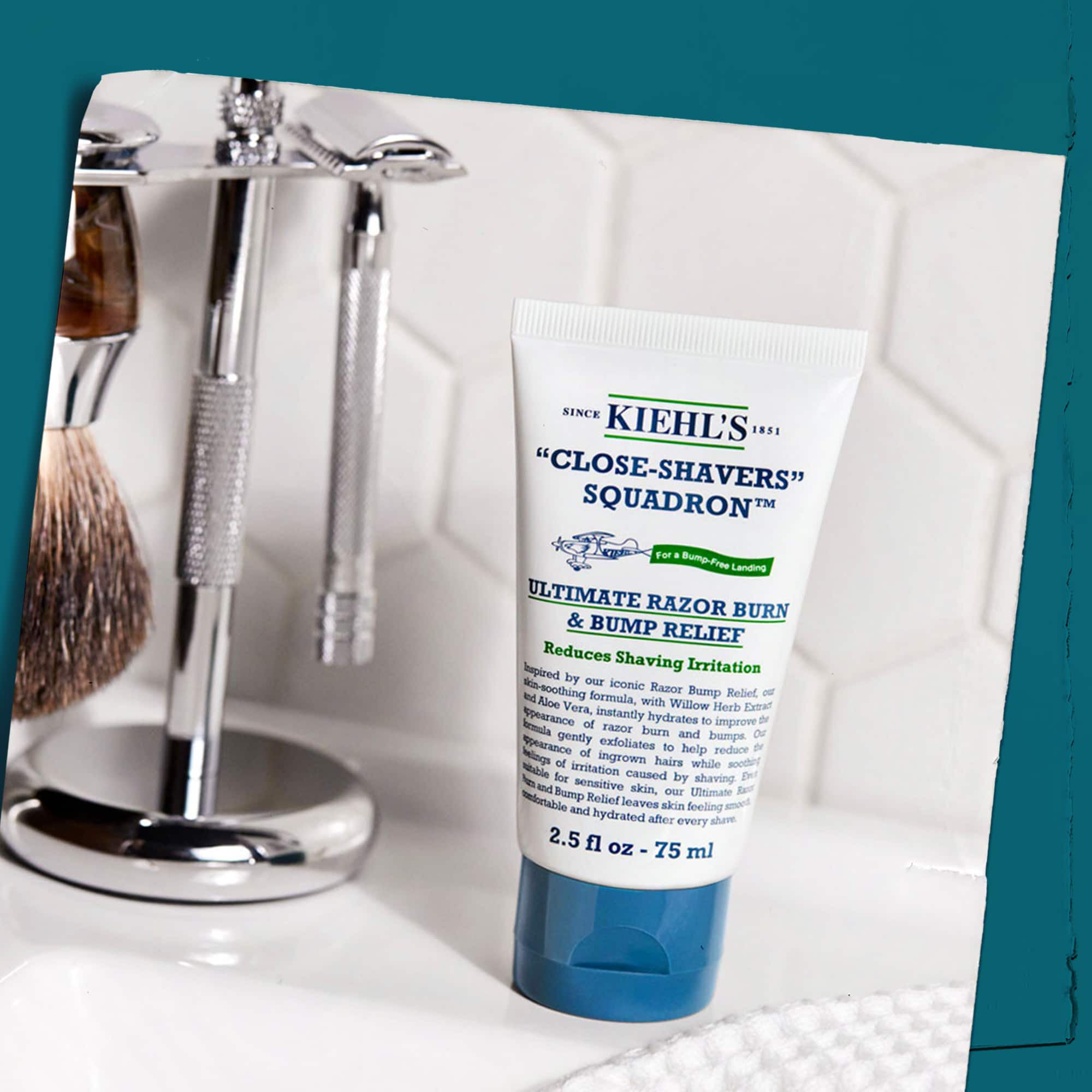 Tube de Close Shavers Squadron Smooth Glider Precision Shave Lotion presente avec des outils de rasage, soulignant son utilisation dans une routine de rasage.