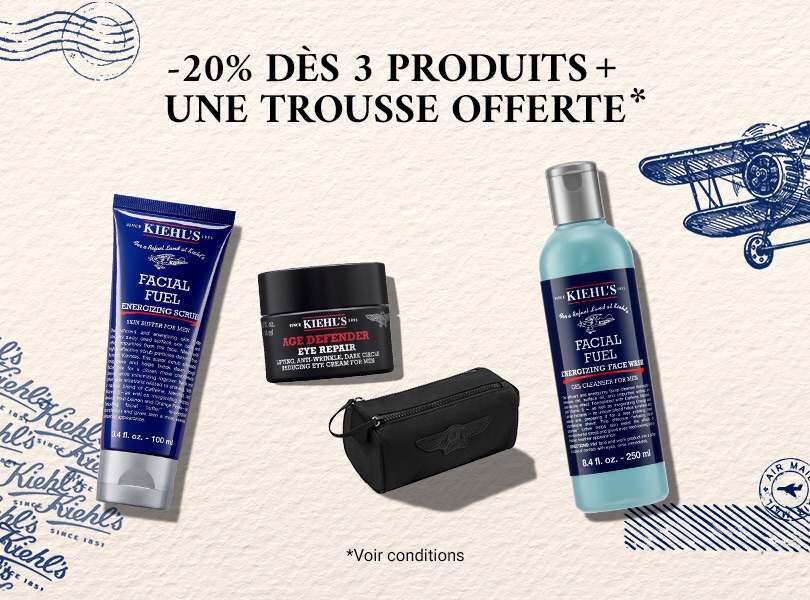 trois flacons de creme kiehl's avec une trousse noire sur un fond beige