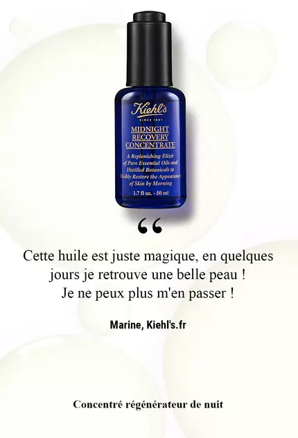 A bottle of Kiehl's Midnight Recovery Concentrate oil with a light, soft-focus background. The text in French praises the product, saying it is magical and essential for beautiful skin.
