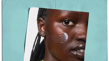 Creme hydratante Ultra de Kiehl's sur un fond marbre, entouree d'olives et d'un petit flacon.