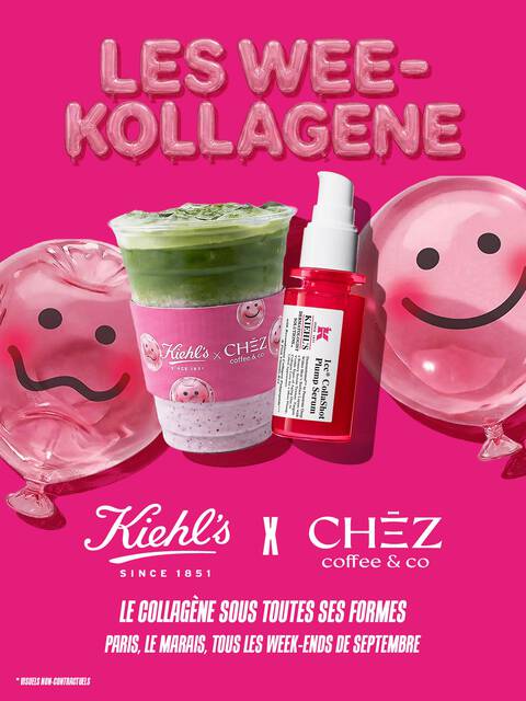 Des produits de soin disposes sur un fond en papier blanc texture. L'element principal est un flacon de serum pour le visage en verre translucide rose vif, dote d'une pompe blanche
