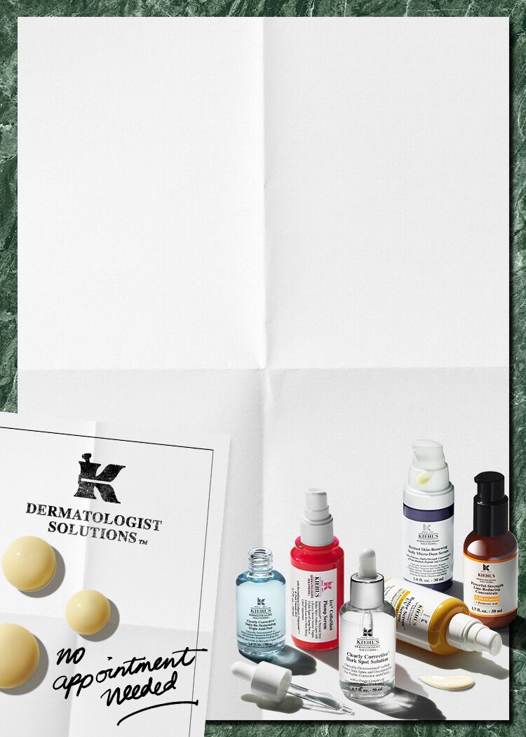 Plusieurs serums kiehl's de couleurs rose, violet, jaune, bleu marron poses sur un fond blanc.