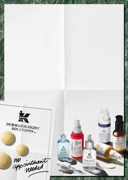 Plusieurs serums kiehl's de couleurs rose, violet, jaune, bleu marron poses sur un fond blanc.