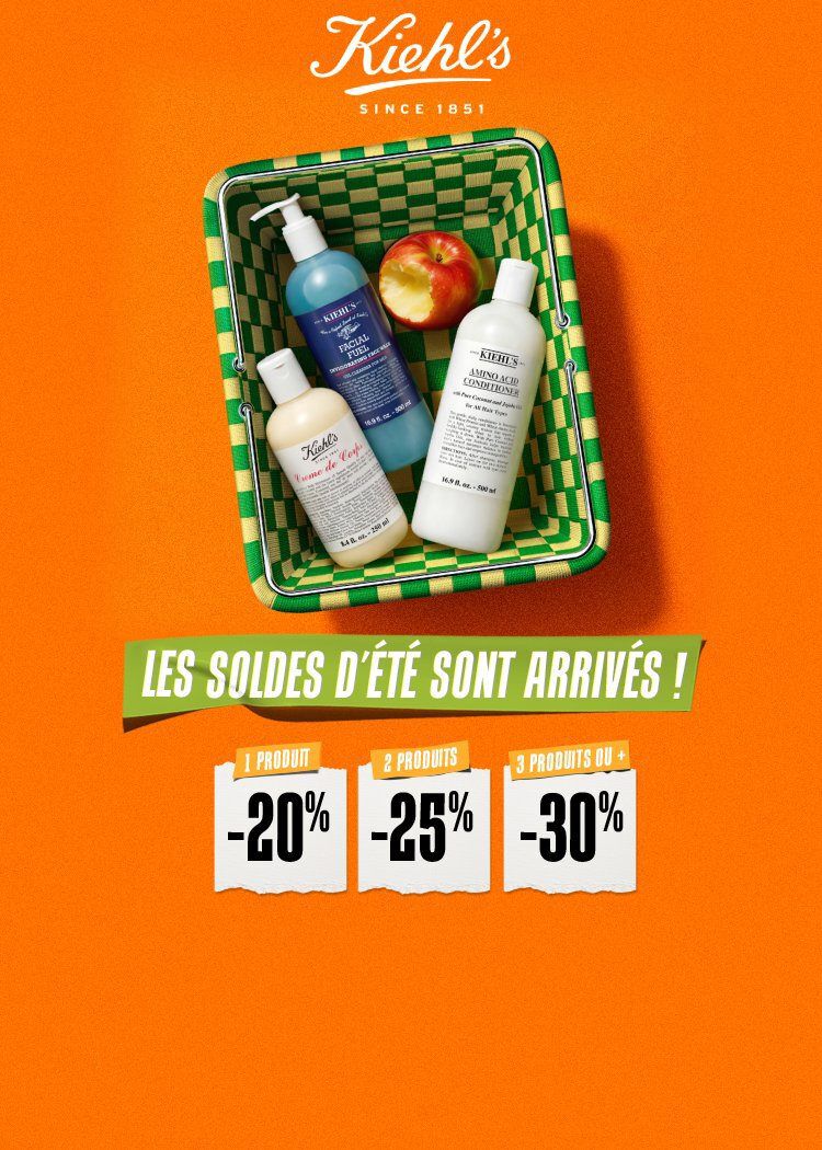 un panier vert et jaune avec a l'interieur une pomme et trois produits de soin de la peau kiehl's sur un fond orange