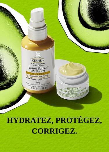 Un pot de soin contour des yeux couvercle ouvert, a cote d'un flacon pompe jaune et blanc, les deux projetant des ombres sur un fond vert avec deux avocats.