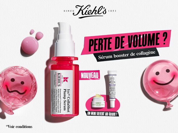 Des produits de soin disposes sur un fond en papier blanc texture. L'element principal est un flacon de serum pour le visage en verre translucide rose vif, dote d'une pompe blanche.