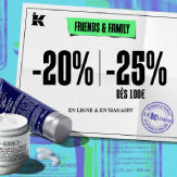 trois flacons de creme kiehl's avec une trousse noire sur un fond beige