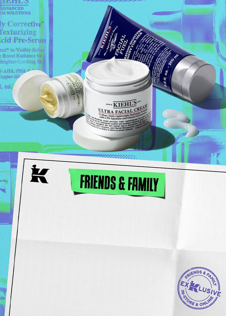 deux pots de creme visage blancs et un tube de creme bleu kiehl's sur un fond bleu