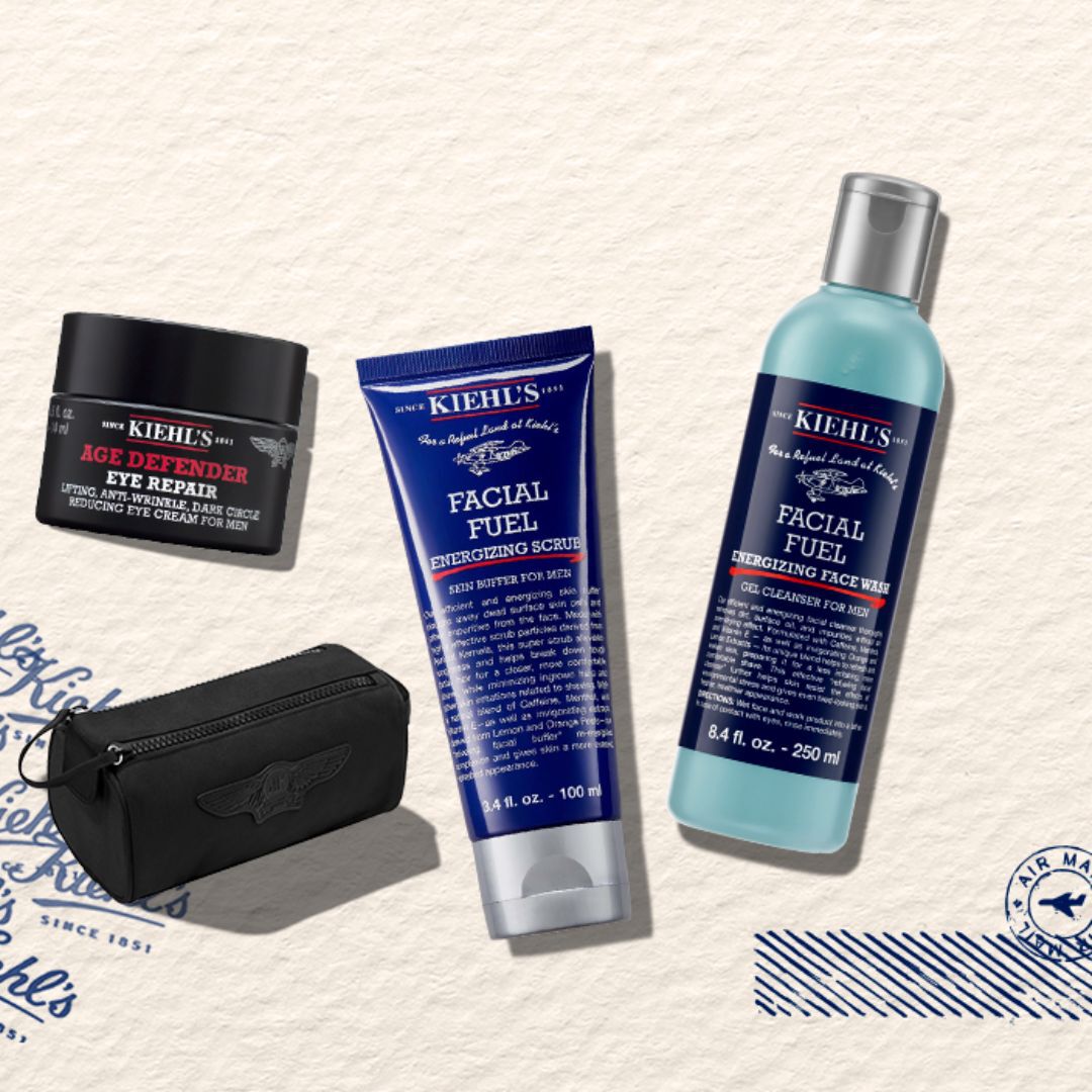 trois flacons de creme kiehl's avec une trousse noire sur un fond beige