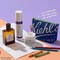 trois flacons de creme kiehl's avec une trousse noire sur un fond beige
